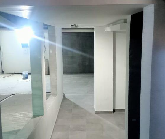 The installation of flooring, baseboards, and painting in the lobby area is completed