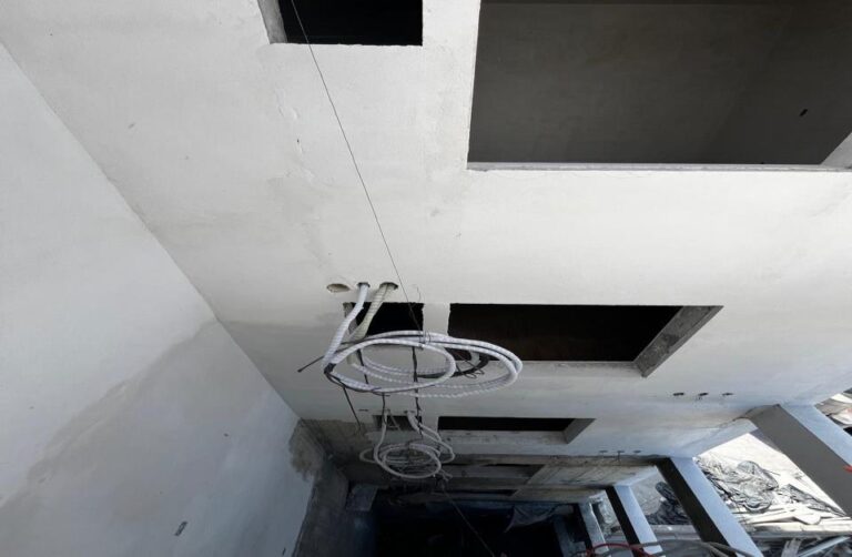 Progress in cleaning and stucco application on lighting boxes