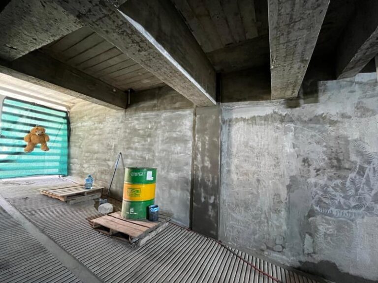 Cleaning of basement walls, vehicle access ramp area
