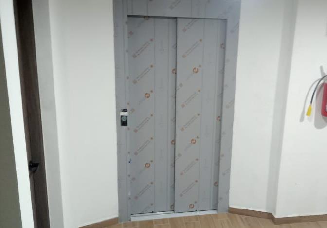 Completion of patching and painting in the second level apartment walkway