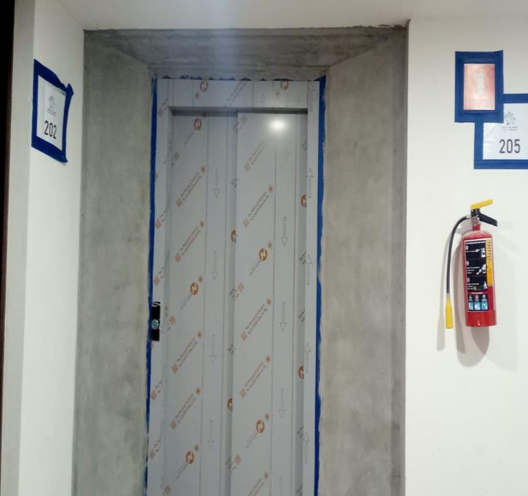Completion of finish wall installation for elevator at level 2