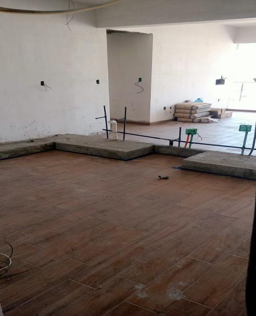 Completion of flooring and baseboard installation in unit 701